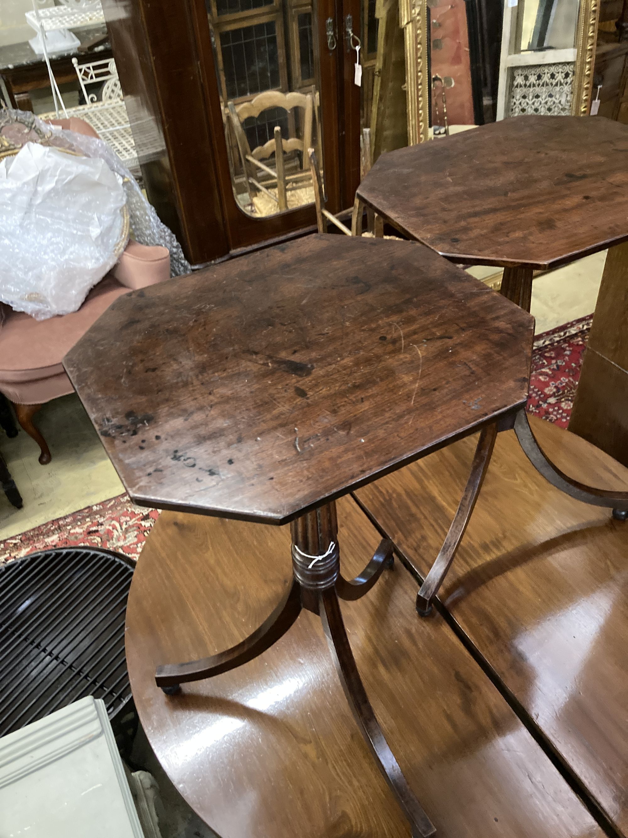 A pair of Regency style octagonal mahogany tripod wine tables, width 44cm depth 38cm height 72cm